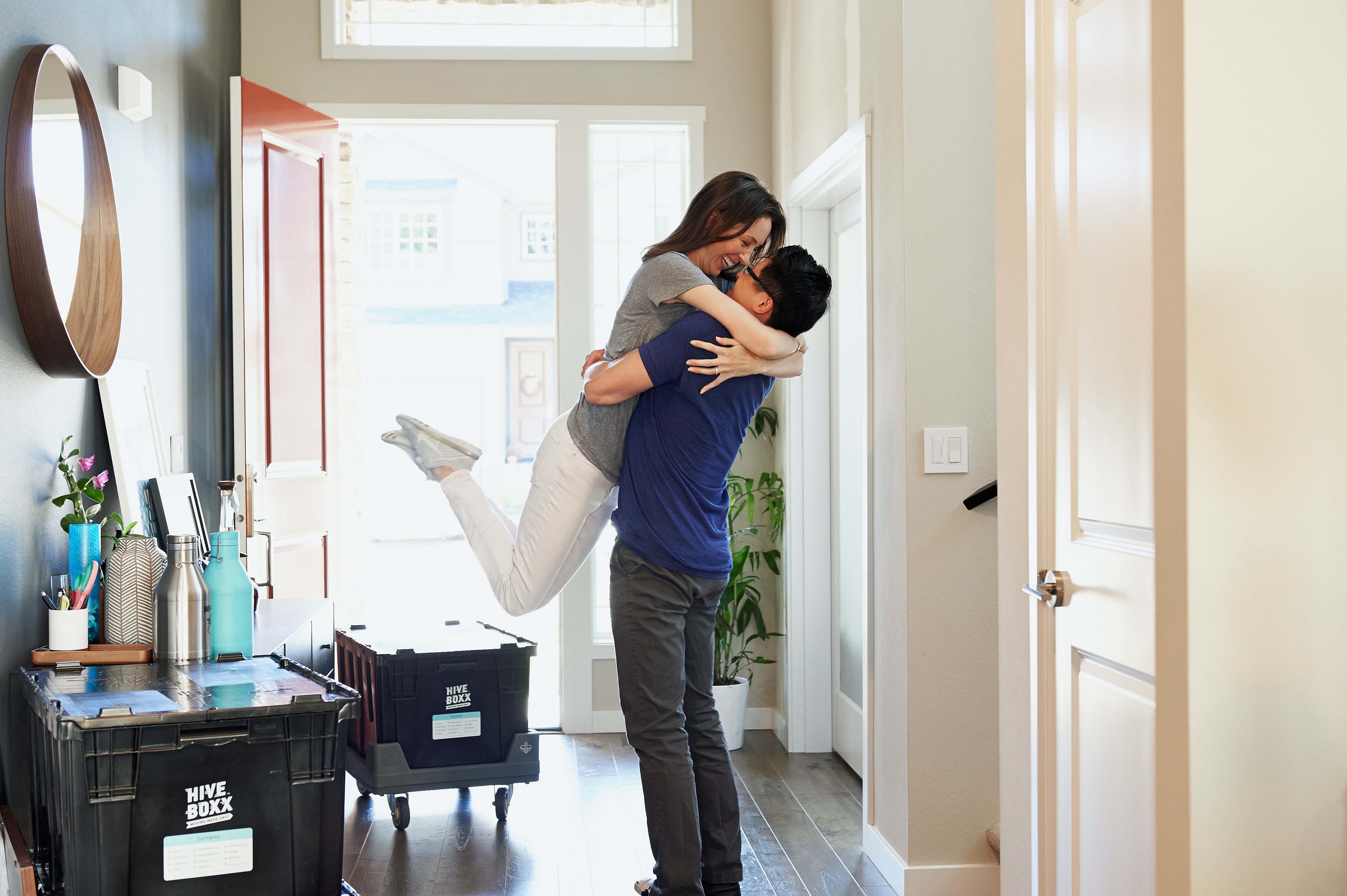Couple celebrating moving into new home.
